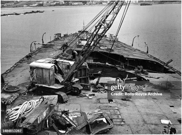 Undated May 1952: Raising the HMS Warspite Battleship May 1952 - Rolls-Royce Derwent V aero engines were used as air pumps to expel sea water from...