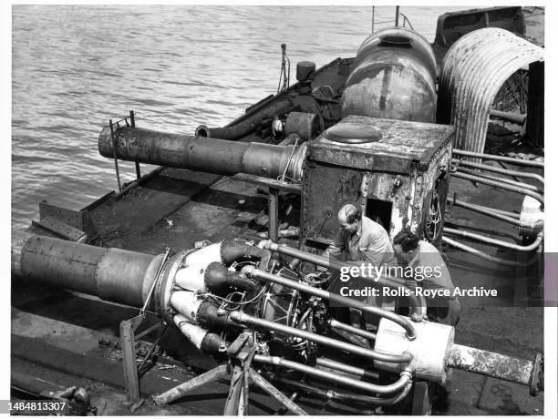 Undated May 1952: Raising the HMS Warspite Battleship May 1952 - Rolls-Royce Derwent V aero engines were used as air pumps to expel sea water from...