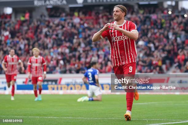 Lucas Hoeler of SC Freiburg celebrates after scoring his team’s third goal during the Bundesliga match between Sport-Club Freiburg and FC Schalke 04...
