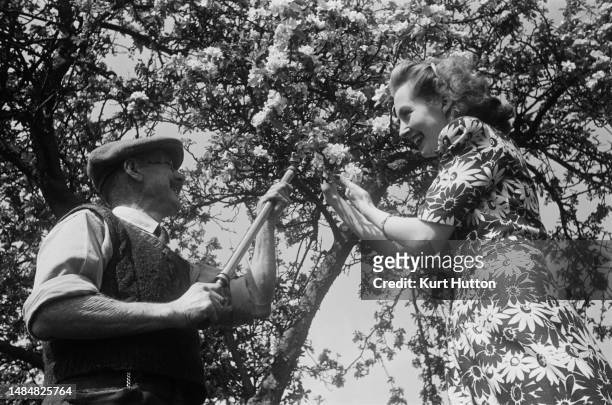 Man and a woman gardening in Aldworth, Berkshire, March 1945. Original Publication: Picture Post - 1713 - Anne Scott-James Cottage - unpub.