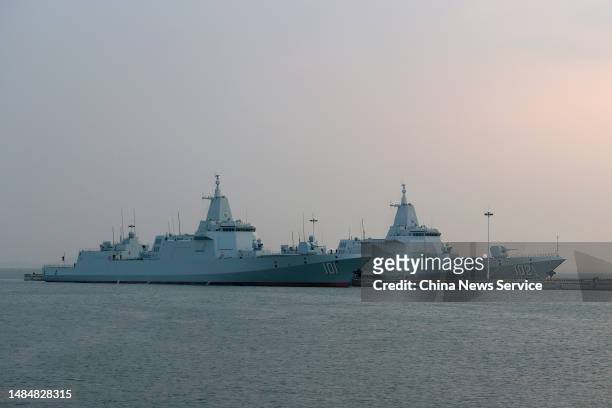 The Type 055 guided-missile destroyer Nanchang and the Type 055 guided-missile destroyer Lhasa are seen at Qingdao Port ahead of an activity to...