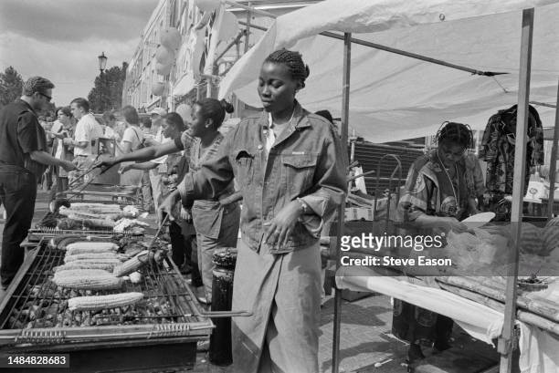 Stall serves food for revellers at the Notting Hill Carnival in West London, August 1995.