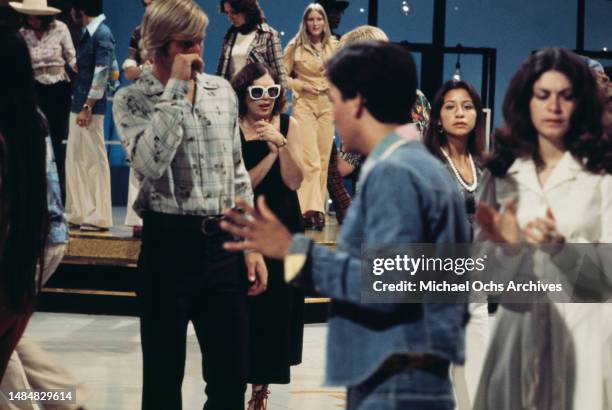 Audience members and dancers during the recording of the American music show 'American Bandstand' on Stage 5 of the ABC Television Center in Los...