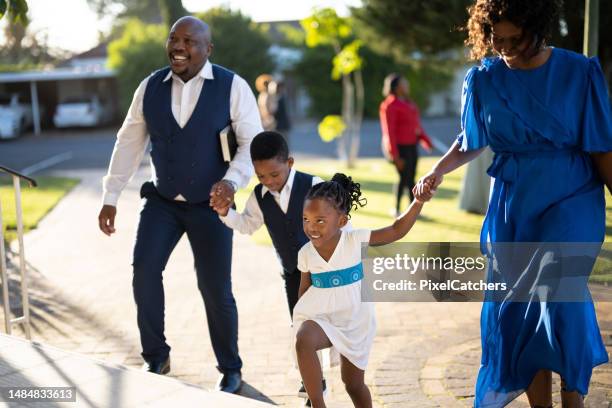 family arriving at church - place of worship stock pictures, royalty-free photos & images