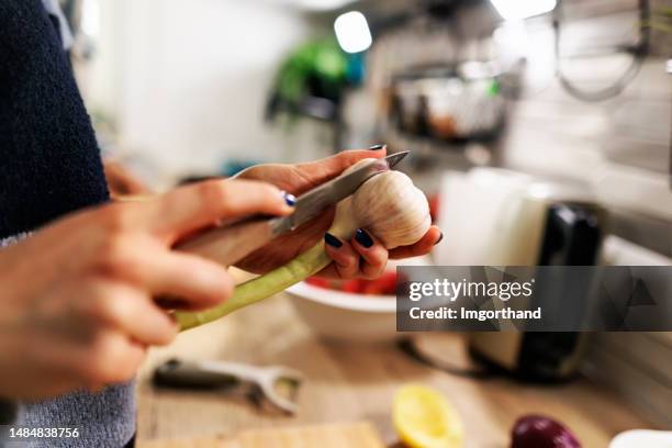 generation z teenagers making salad in kitchen - chopping garlic stock pictures, royalty-free photos & images
