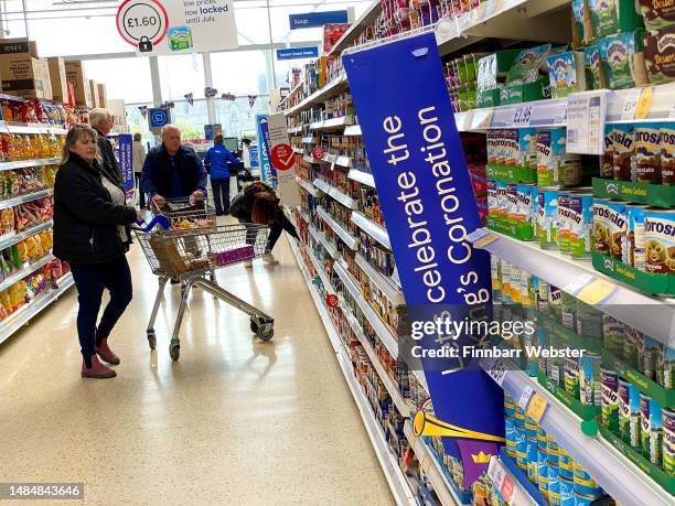 Signs reading, 'Let's celebrate the King's Coronation' are seen in a Tesco store, on April 24, 2023 in Portland, England. The Coronation of King...