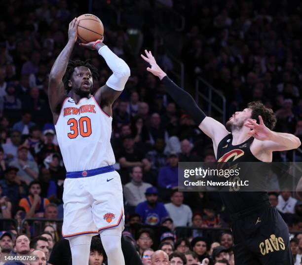 New York Knicks forward Julius Randle takes the shot over Cleveland Cavaliers forward Cedi Osman in 2nd quarter during Game Four of the Eastern...