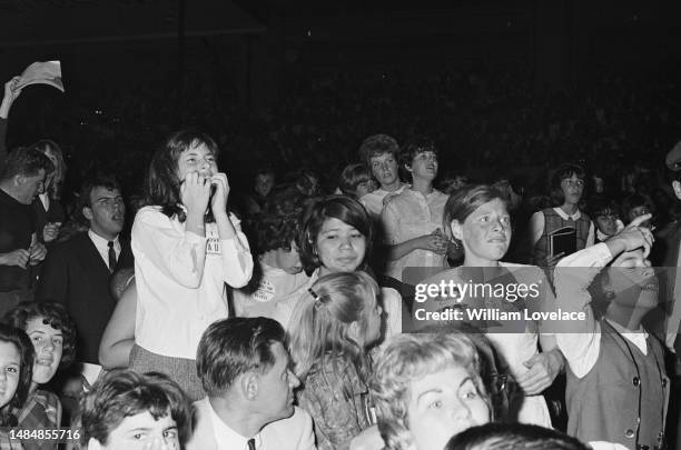 Fans at a Beatles concert at the Cow Palace in Daly City, near San Francisco, California, during their Summer 1964 United States and Canada Tour,...