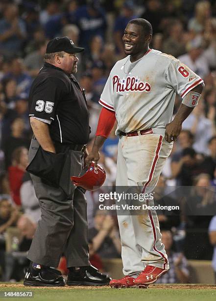 Ryan Howard of the Philadelphia Phillies laughs in disbelief after being called out on the play at homeplate by MLB home plate umpire Wally Bell in...