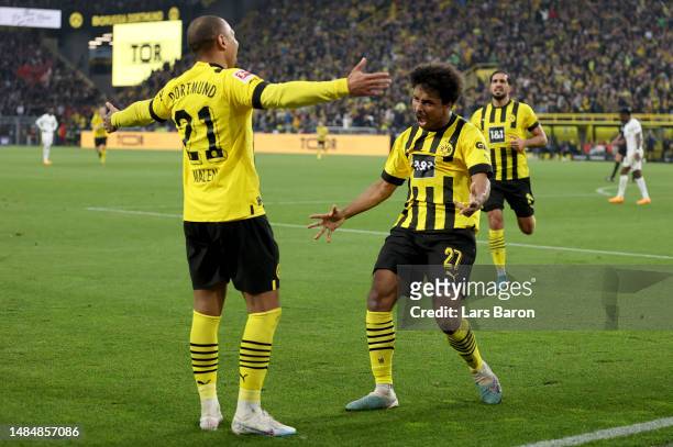 Karim Adeyemi of Dortmund celebrates with Donyell Malen of Dortmund during the Bundesliga match between Borussia Dortmund and Eintracht Frankfurt at...