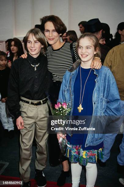 Austin O'Brien, Jamie Lee Curtis and Anna Chlumsky attend My Girl 2 premiere, United States, 1994.