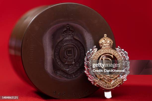 Photo illustration of the stamping die for the core of royal engineers with the new tudor Crown and CR III Cypher, ahead of the Kings Coronation seen...