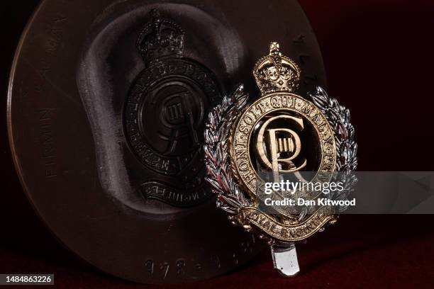 Photo illustration of the stamping die for the core of royal engineers with the new tudor Crown and CR III Cypher, ahead of the Kings Coronation seen...