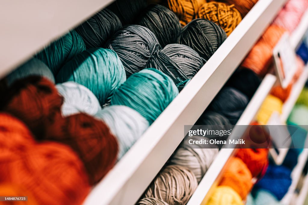 Colorful vibrant wool or cotton threads from above. Close up view, copy space.
