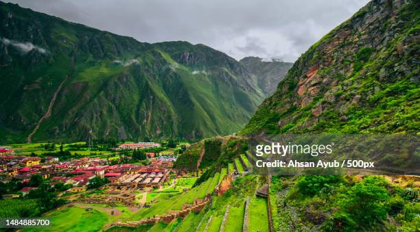 scenic view of a peruvian townscape against sky,ollantaytambo,peru - terraced field stock pictures, royalty-free photos & images