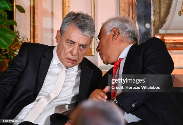 Brazilian singer and composer Chico Buarque chats onstage with Portuguese Prime Minister Antonio Costa during the ceremony of the Camões Prize to...