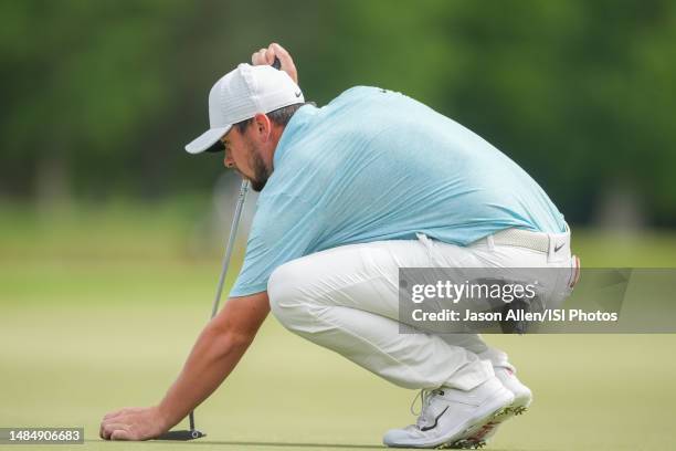 Alex Fitzpatrick of England checks his line before putting on the 18th green during the Final Round of the Zurich Classic of New Orleans at TPC...