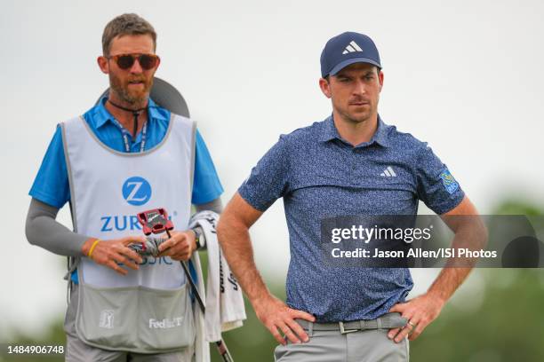 Nick Taylor of Canada waits for others to finish putting on the 18th green during the Final Round of the Zurich Classic of New Orleans at TPC...
