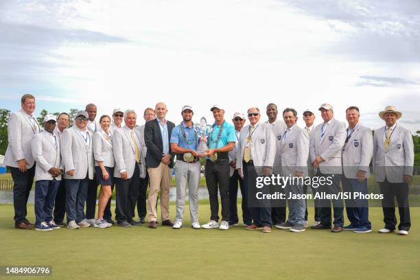 Davis Riley and Nick Hardy of the United States pose with their trophy and belts on the 18th green during the Final Round of the Zurich Classic of...