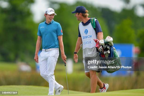 Matt Fitzpatrick of England walks to the 18th green with his caddy during the Final Round of the Zurich Classic of New Orleans at TPC Louisiana on...