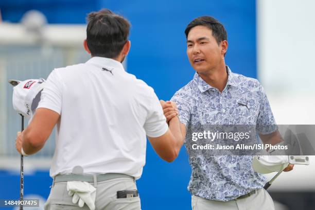 Justin Sue of the United States congratulates Hayden Buckley of the United States on the 18th green after finishing their round during the Final...