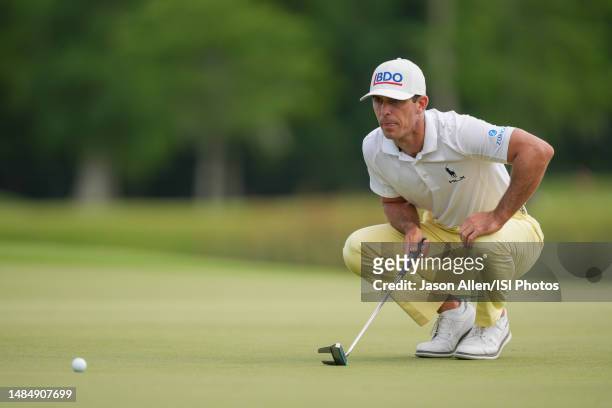 Billy Horschel of the United States check the line before putting on the 18th green during the Final Round of the Zurich Classic of New Orleans at...
