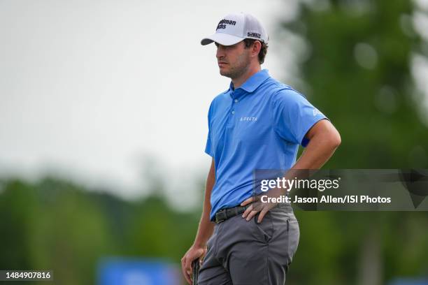 Patrick Cantaly of the United States relax briefly after finishing his turn on the 18th green during the Final Round of the Zurich Classic of New...