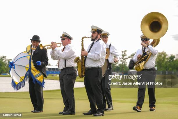 The marching band that accompanied the winners to the award ceremony on the 18th green during the Final Round of the Zurich Classic of New Orleans at...