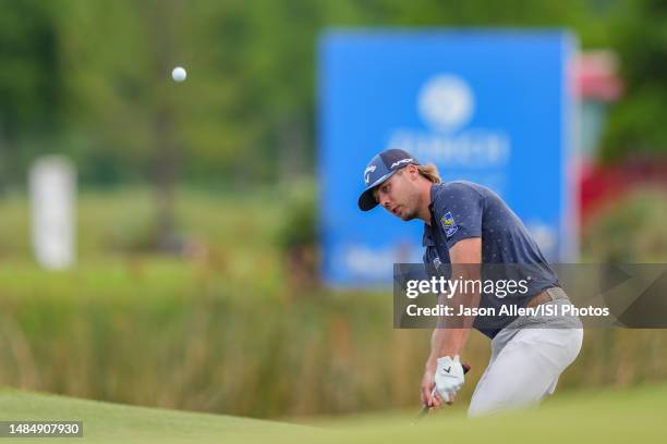 Sam Burns of the United States chips onto the 18th green during the Final Round of the Zurich Classic of New Orleans at TPC Louisiana on April 23,...