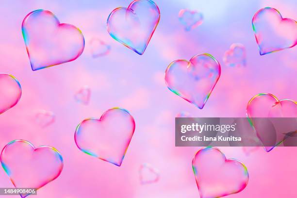 colorful soap bubbles in shape of heart on sky background. beautiful 3d pattern. pink and purple clouds backdrop. valentine's day. - 浪漫的天空 個照片及圖片檔