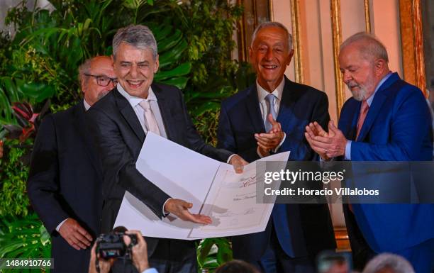 Portuguese President Marcelo Rebelo de Sousa and the President of Brazil Luiz Inácio Lula da Silva applaud as Brazilian singer and composer Chico...