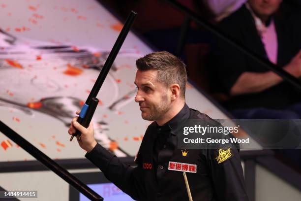 Mark Selby of England celebrates victory following their round two match against Gary Wilson of England on Day Ten of the Cazoo World Snooker...