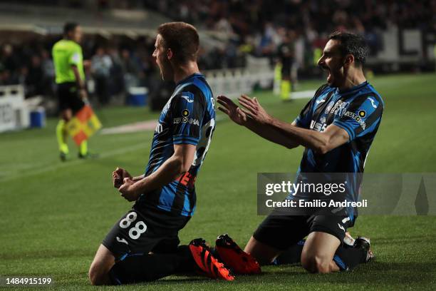 Mario Pasalic of Atalanta BC celebrates with teammate Davide Zappacosta after scoring the team's first goal during the Serie A match between Atalanta...