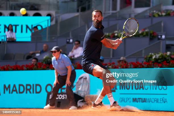 Benoit Paire of France looks to return a ball against Francesco Passaro of Italy in their Men's Singles 1st Round Qualifying match during day one of...