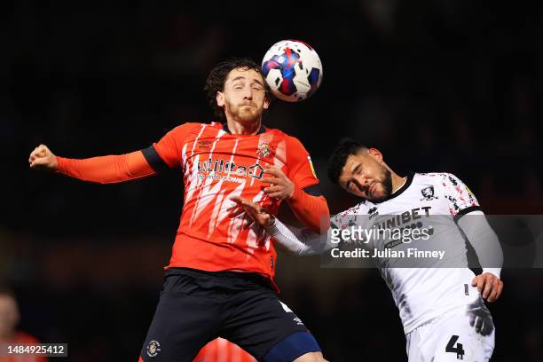 Tom Lockyer of Luton Town and Alex Mowatt of Middlesbrough battle for a header during the Sky Bet Championship match between Luton Town and...