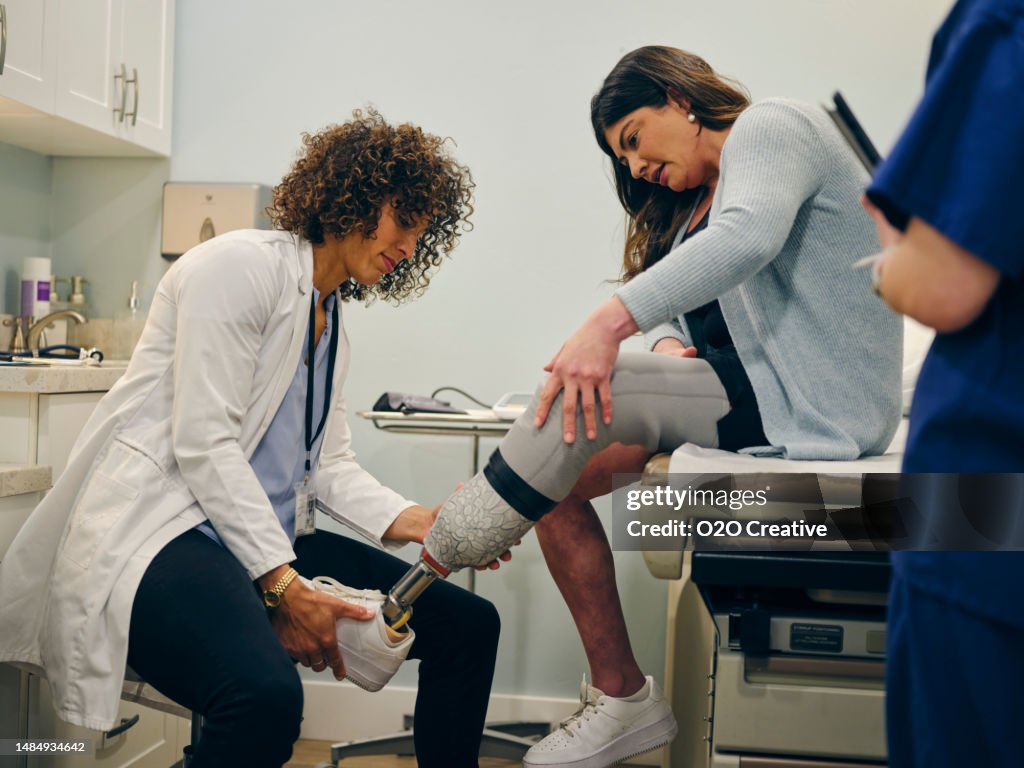 Female Doctor and Amputee Patient