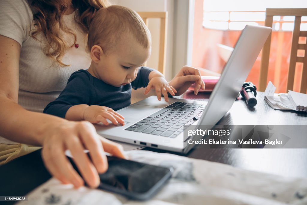 Baby Computer Work Home Office Concept Mom And Baby Working On A Laptop High-Res Stock ...