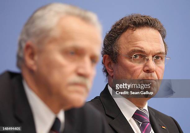 German Interior Minister Hans-Peter Friedrich and outgoing president of the Federal Office for the Protection of the Constitution Heinz Fromm speak...