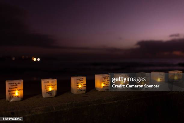 Candles are seen representing Manly Surf Lifesaving Club members who lost their lives serving in the Australian Defence Force during an ANZAC Day...