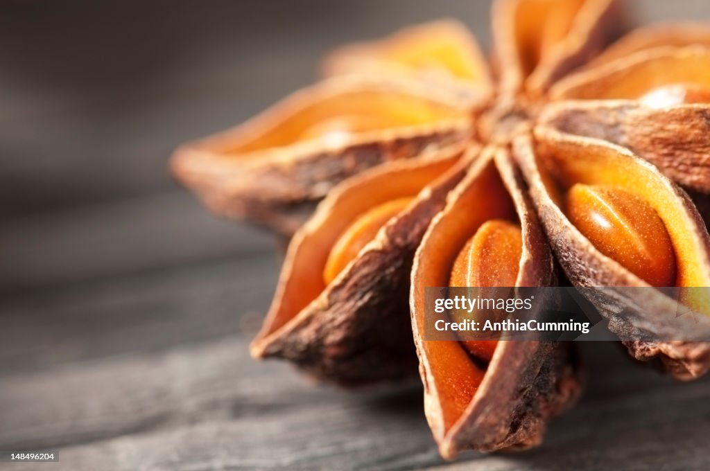 Star anise cooking spice drying on a bamboo mat