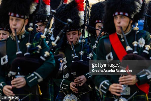 Members of bagpipe band march and perform during the Anzac day parade on April 25, 2023 in Melbourne, Australia. Anzac Day is a national holiday in...