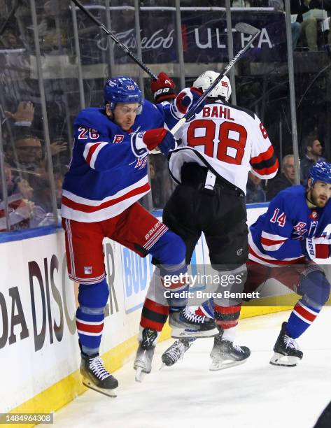 Jimmy Vesey of the New York Rangers and Kevin Bahl of the New Jersey Devils collide during the second period in Game Four of the First Round of the...