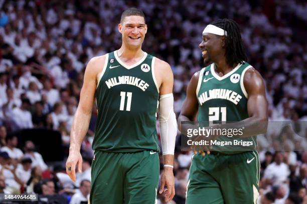 Brook Lopez and Jrue Holiday of the Milwaukee Bucks react during the second quarter against the Miami Heat in Game Four of the Eastern Conference...