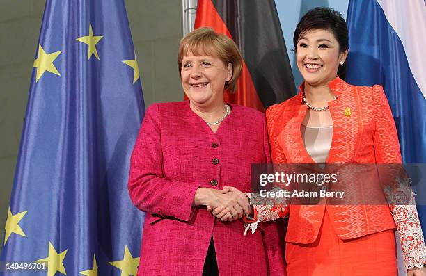 Thai Prime Minister Yingluck Shinawatra and German Chancellor Angela Merkel shake hands after a news conference at the German federal chancellory on...