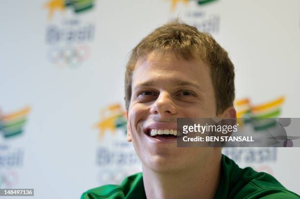 Brazil's Cesar Cielo speaks during a press conference following a training session ahead of the London 2012 Olympic Games in Crystal Palace in London...