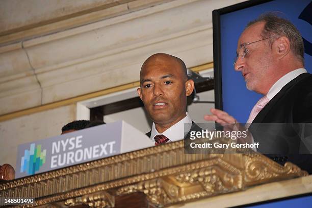 New York Yankees closing pitcher Mariano Rivera and John Halvey ring the opening bell at the New York Stock Exchange on July 18, 2012 in New York...