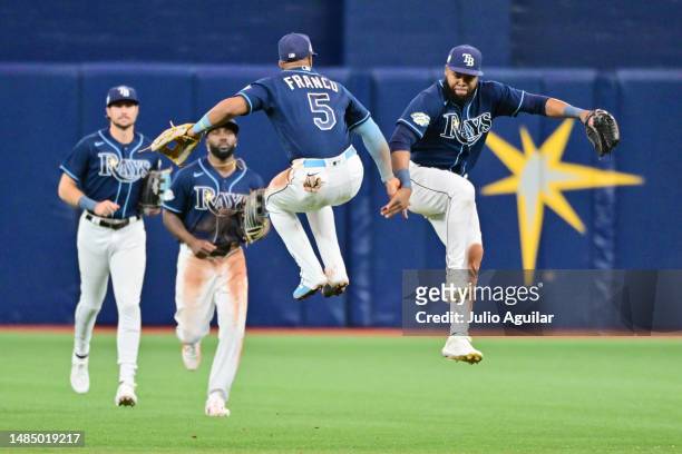 Wander Franco and Manuel Margot of the Tampa Bay Rays celebrate after defeating the Houston Astros 8-3 at Tropicana Field on April 24, 2023 in St...