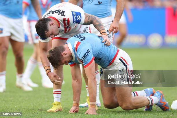 Paul Momirovski of the Roosters seeks attention from Jack Bird of the Dragons after a tackle during the round eight NRL match between Sydney Roosters...