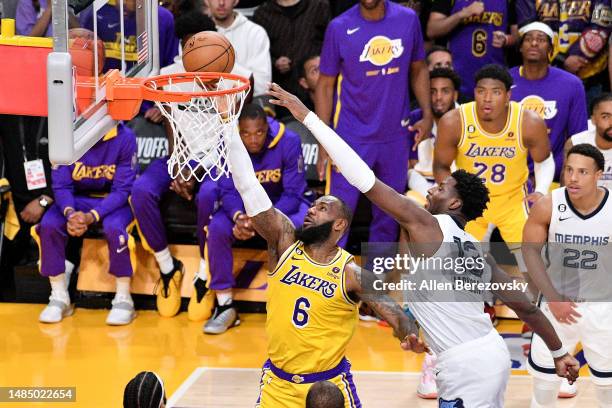 LeBron James of the Los Angeles Lakers glides in for a layup, while being challenged by Jaren Jackson Jr. #13 of the Memphis Grizzlies, during...