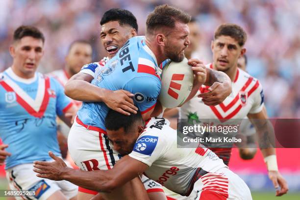 Angus Crichton of the Roosters is tackled during the round eight NRL match between Sydney Roosters and St George Illawarra Dragons at Allianz Stadium...